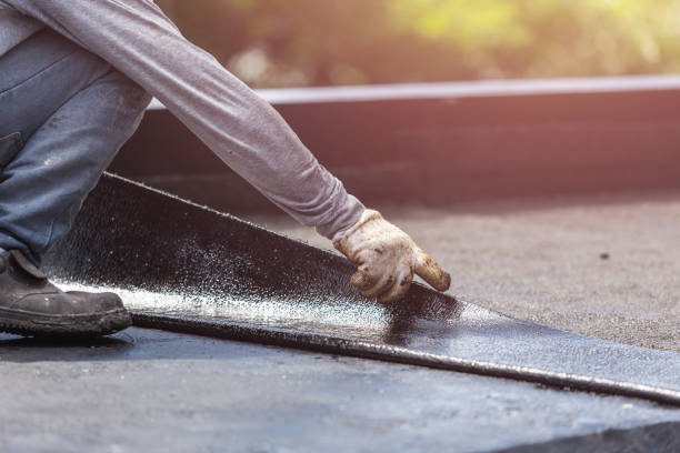 Professional Basement Waterproofing technician working in Brick, NJ